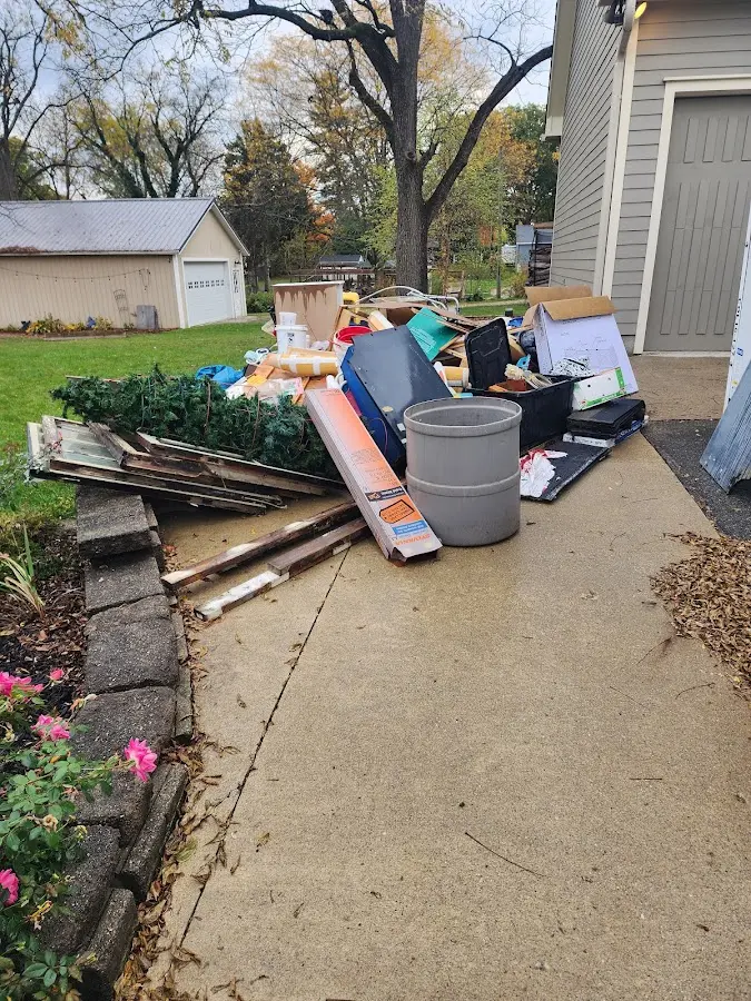Dumpster being loaded with debris for Commercial Dumpster Rental in Rodeo